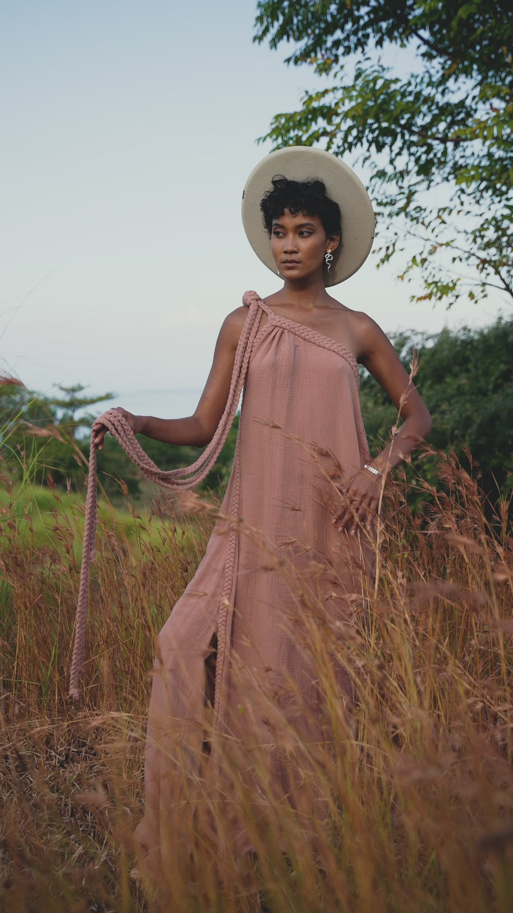 Elevate your style with this stunning powder pink toga dress by Aya Sacred Wear. Add this piece to your wardrobe today.