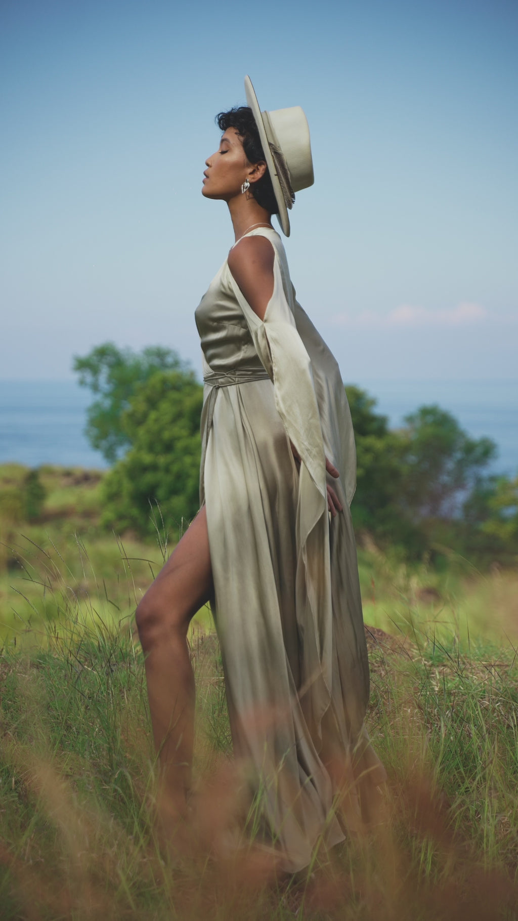 The wrap kimono silhouette and flowing bell sleeves create a bohemian yet sophisticated look.