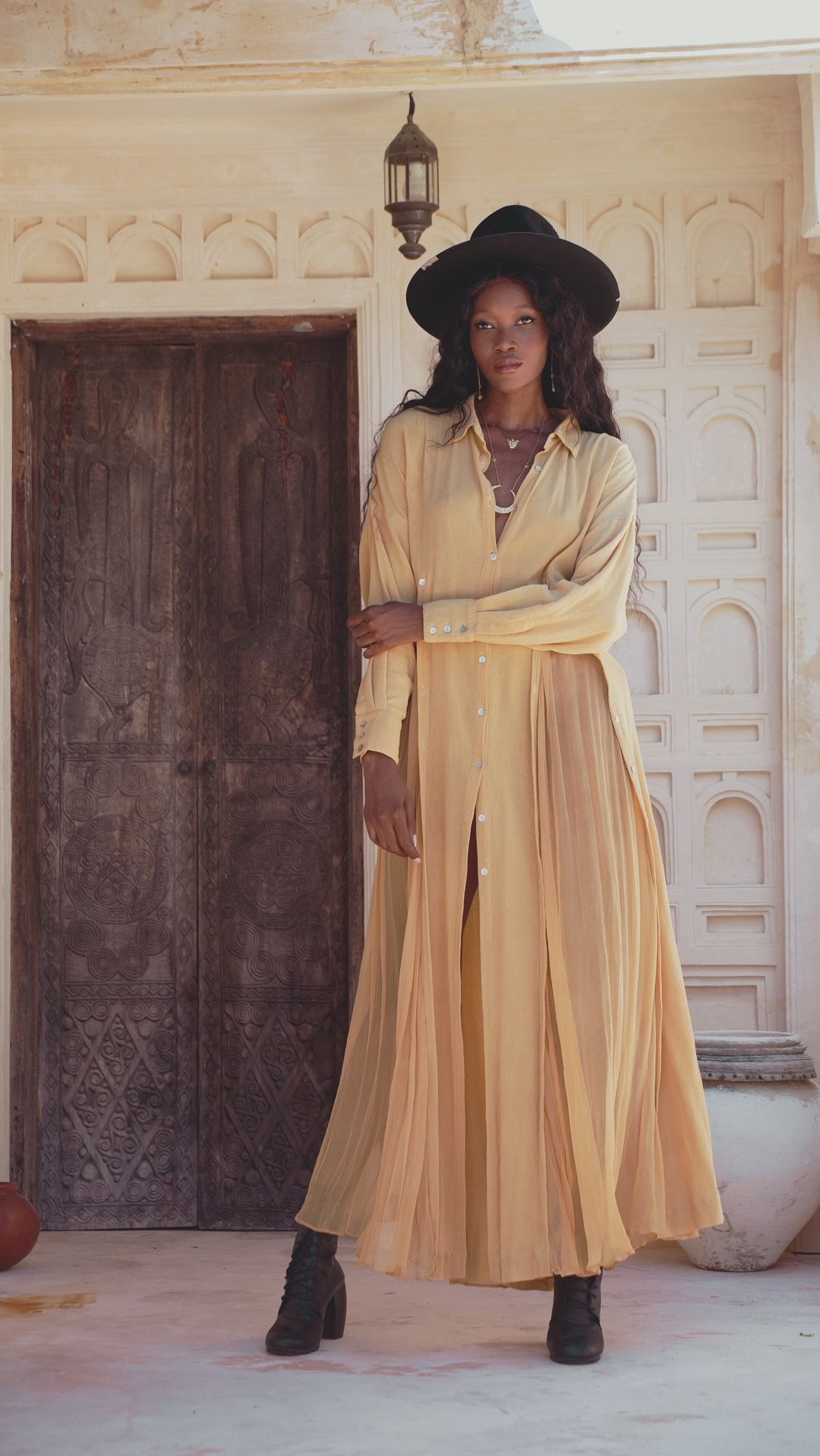 Explore the Ochre Boho Shirt Dress in this video - a versatile Bohemian casual dress with a light cover-up option and unique multiway button-down design.