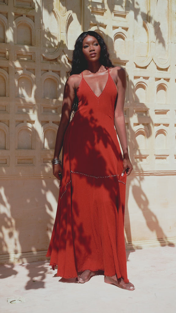 A Red Wine Goddess Dress featuring Bohemian Jingle Bells, a Sexy Open Neckline, styled in Greek Casual fashion, perfect for the Boho hippie look.