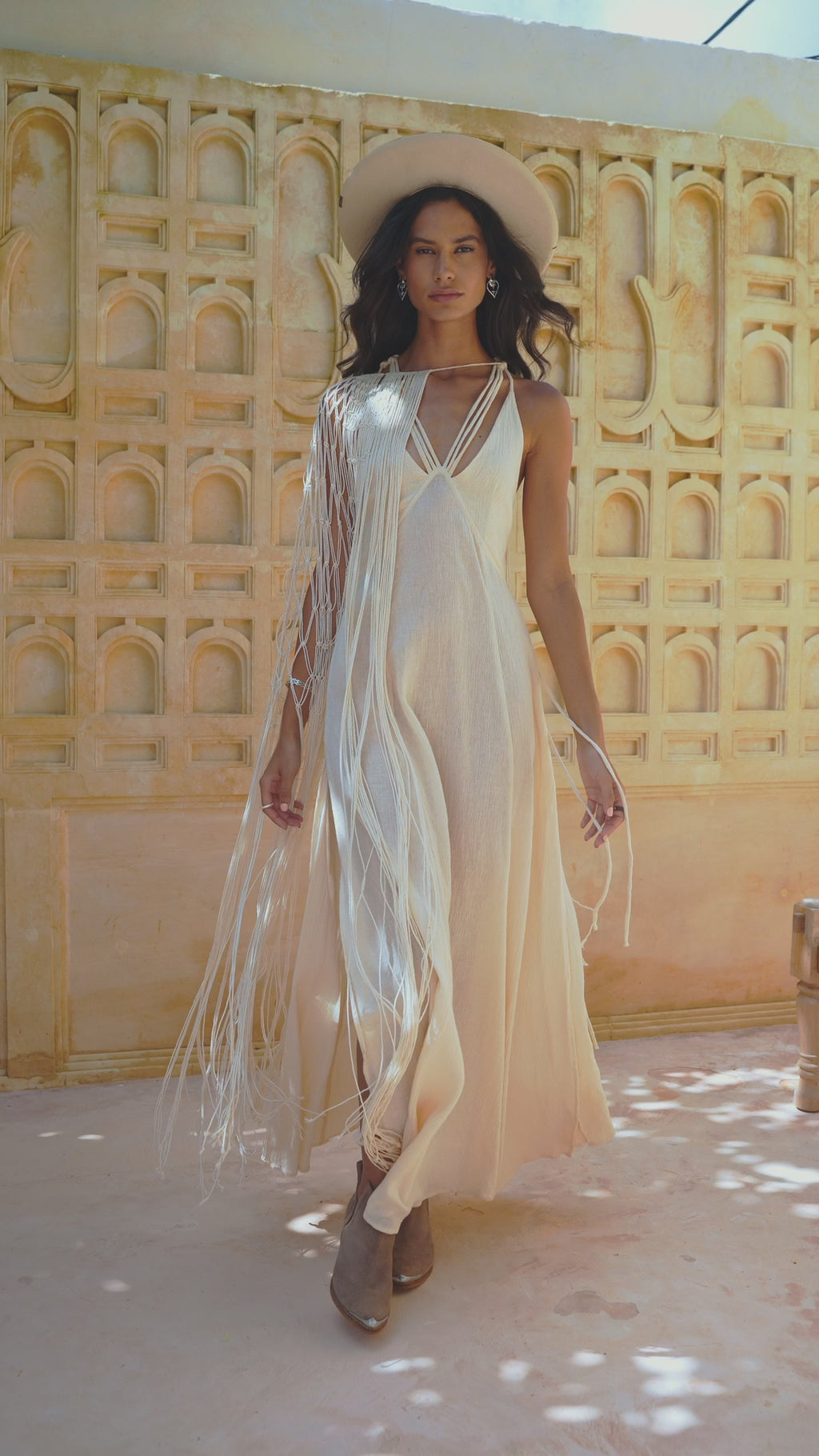 Off-White Boho Goddess Dress with handmade macramé design on the back, adjustable straps for fit, and decorative slits on the front. Made from 50% Linen and 50% Cotton.