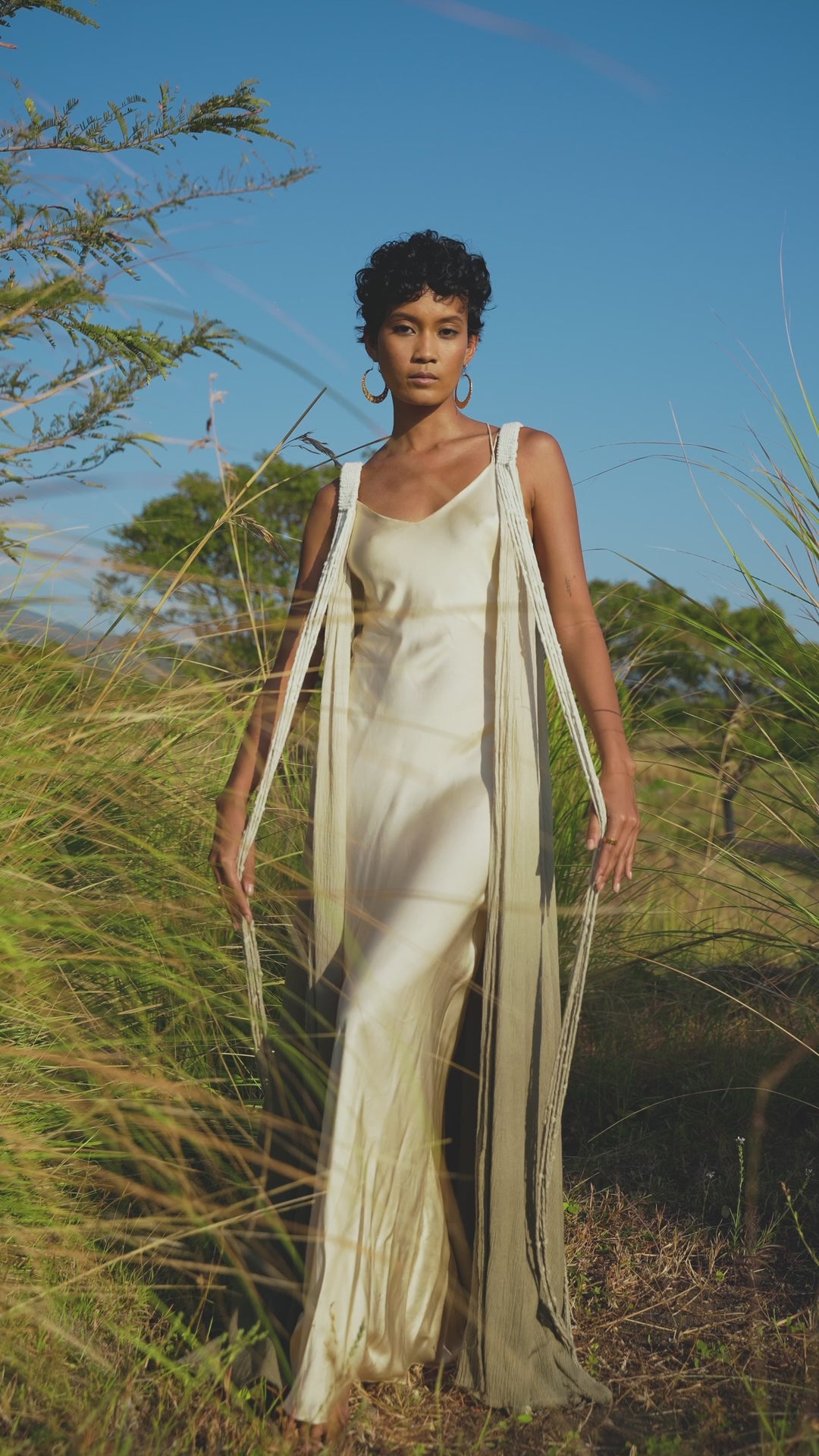 Make a style statement with this handmade Sage Green Macrame Cape by Aya Sacred Wear.