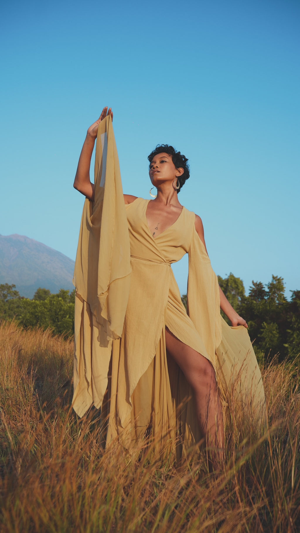 Look irresistible in Aya Sacred Wear's Ochre Boho Goddess Dress with wings. Shop this unique style now!
