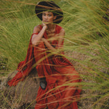 Stand out as a boho goddess in this red wine dress, designed with long bell sleeves for a unique touch.