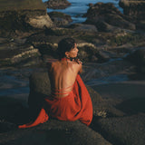 What looks perfect for a beach guest? A red wine goddess dress complete with an adjustable open back & belly. 