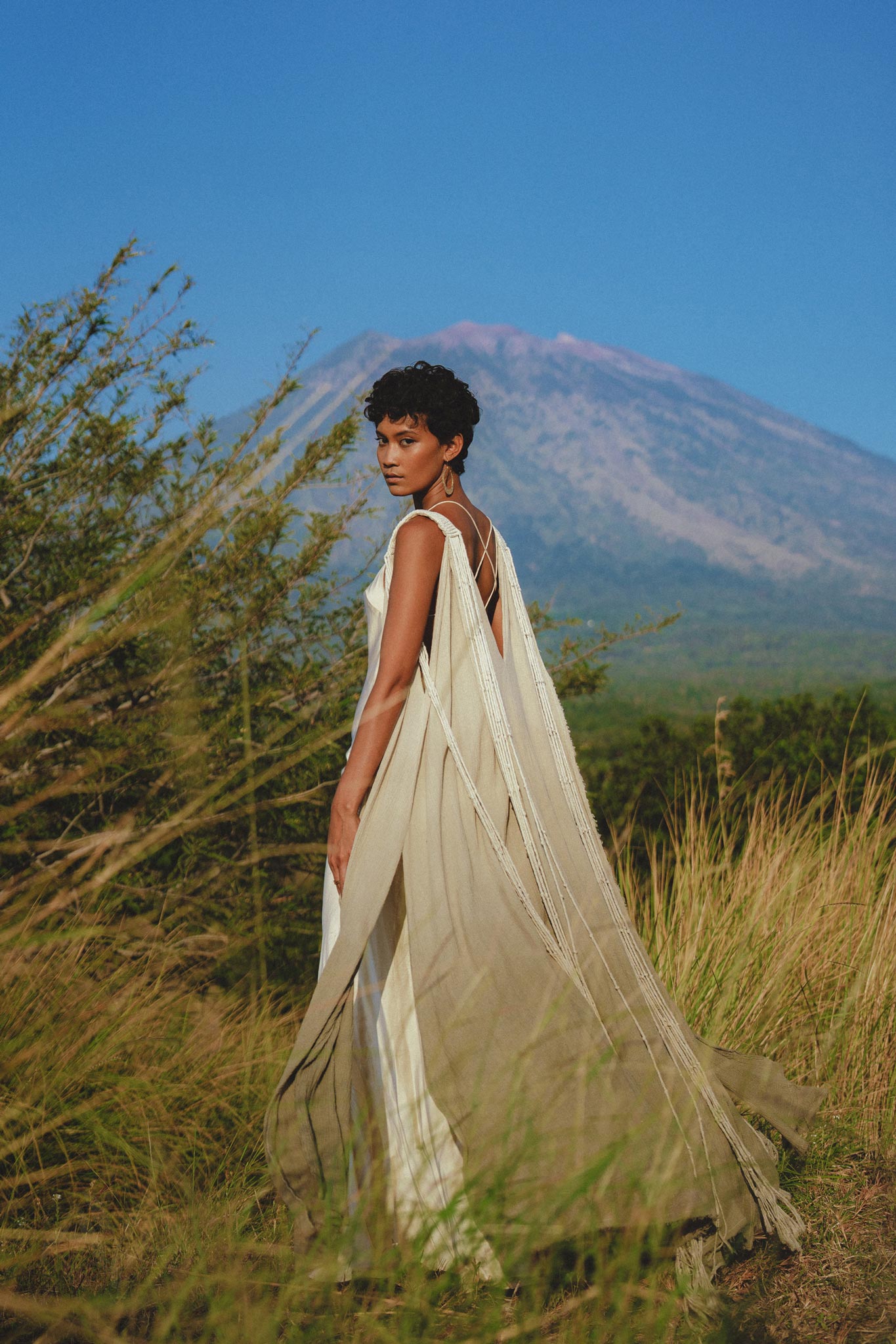 Accessorize your look with this unique Sage Green Macrame Cape by Aya Sacred Wear.