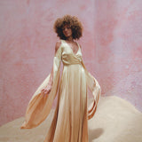 Stand Out in Aya Sacred Wear's Silk Powder Pink Goddess Wrap Dress.