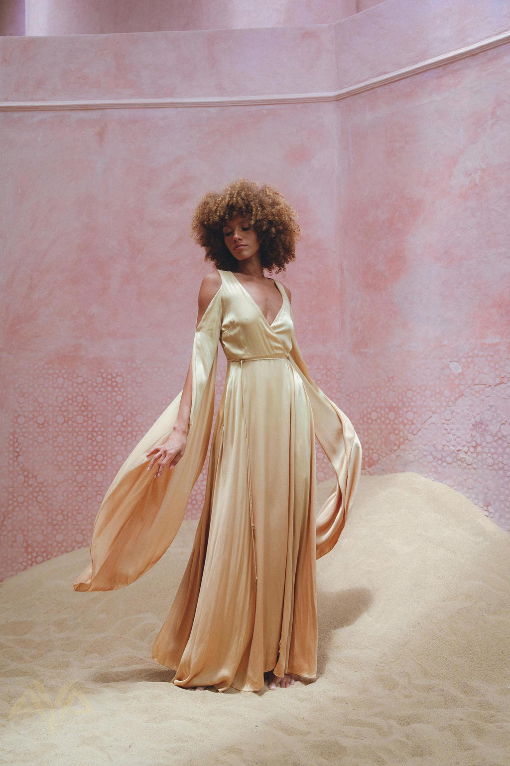 Stand Out in Aya Sacred Wear's Silk Powder Pink Goddess Wrap Dress.