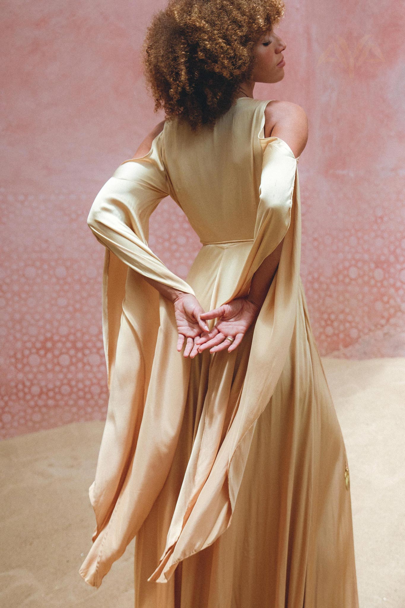 Look Regal in Aya Sacred Wear's Silk Powder Pink Goddess Wrap Dress.