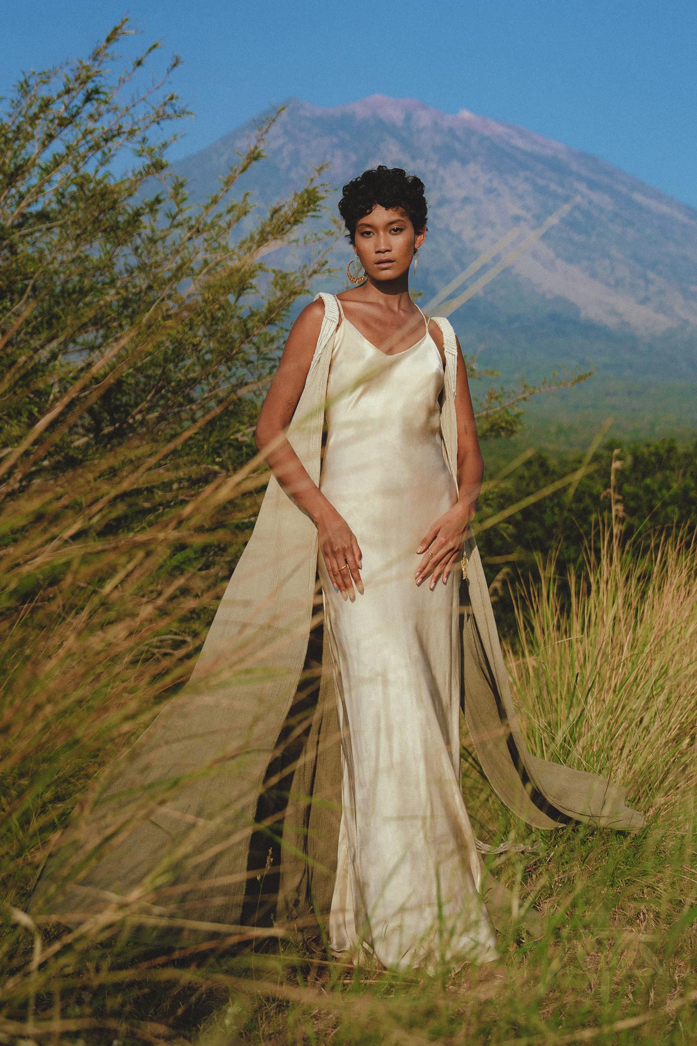 Be the epitome of elegance in this off-white silk wedding dress with a goddess-like vibe.