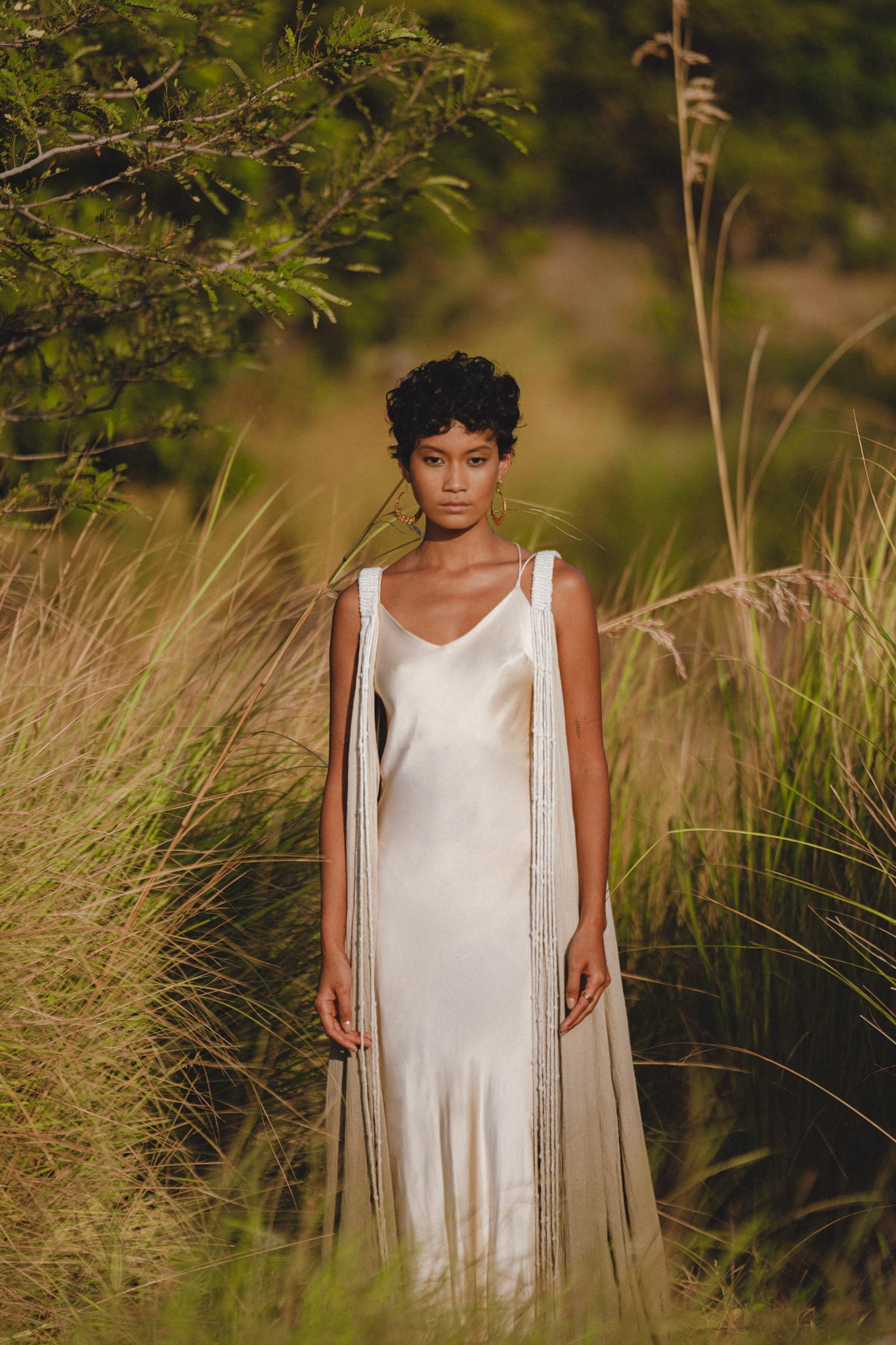 Elegant silk wedding dress with a hint of bohemian flair for your special day.