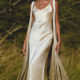 Embrace your inner goddess with this ethereal silk wedding gown in ivory.