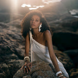 Off-White Greek Goddess Maxi Dress: Embody ethereal beauty in our off-white Greek goddess maxi dress. Handwoven from organic cotton, its draped silhouette and Grecian-inspired design exude timeless grace.