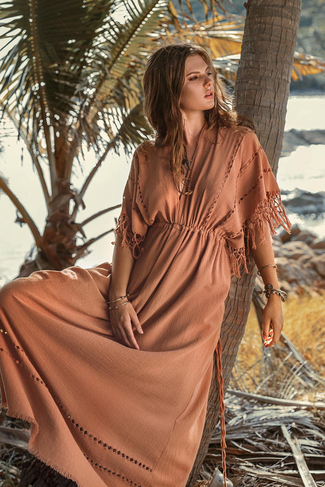 This is a great dress for a summer day at the beach. The light fabric and loose fit will keep you cool and comfortable, and the orange colour will make you feel like you're in the sun. 