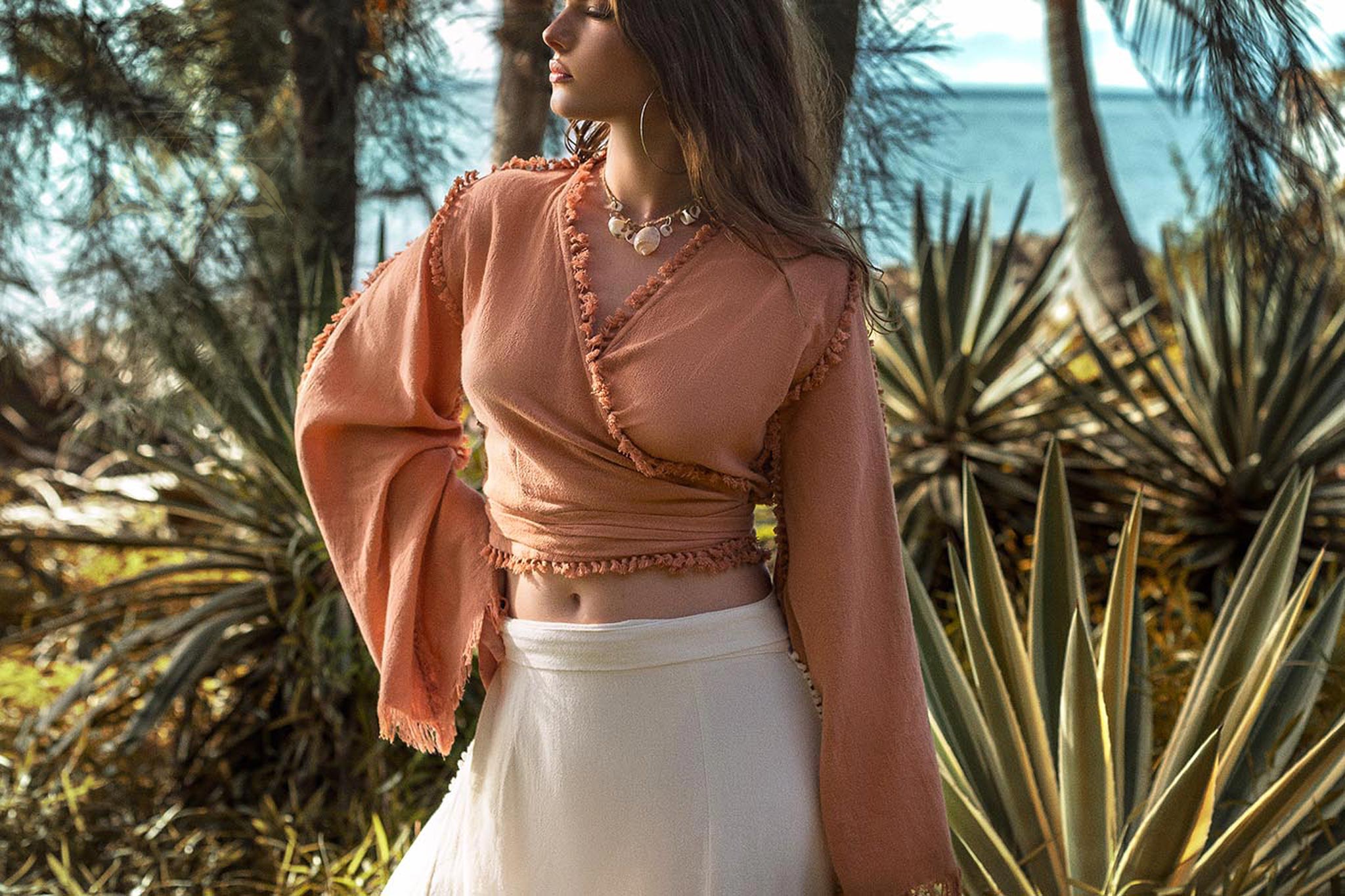Ochre Pale Orange Boho Top this top is a beautiful ochre color with pale orange accents. It's a great boho style top with wide sleeves and decorated with hand knots. This top would look great with any outfit!