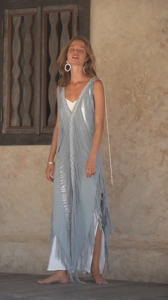 Look stunning this summer in this handmade "Threads of Life" dress, featuring a hand-loomed layover and a unique open "V" side-cut.