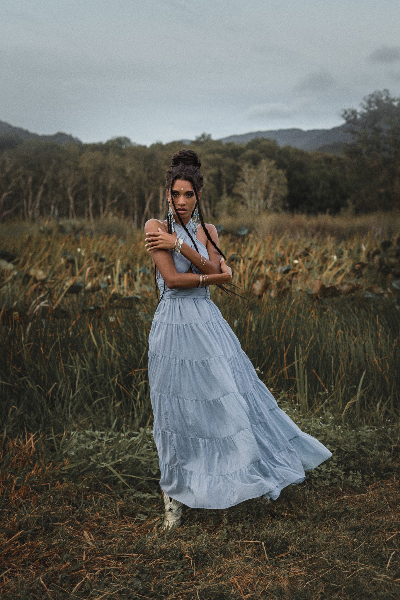 This boho evening dress is perfect for any special occasion. The light blue color and adjustable straps make it both unique and stylish.