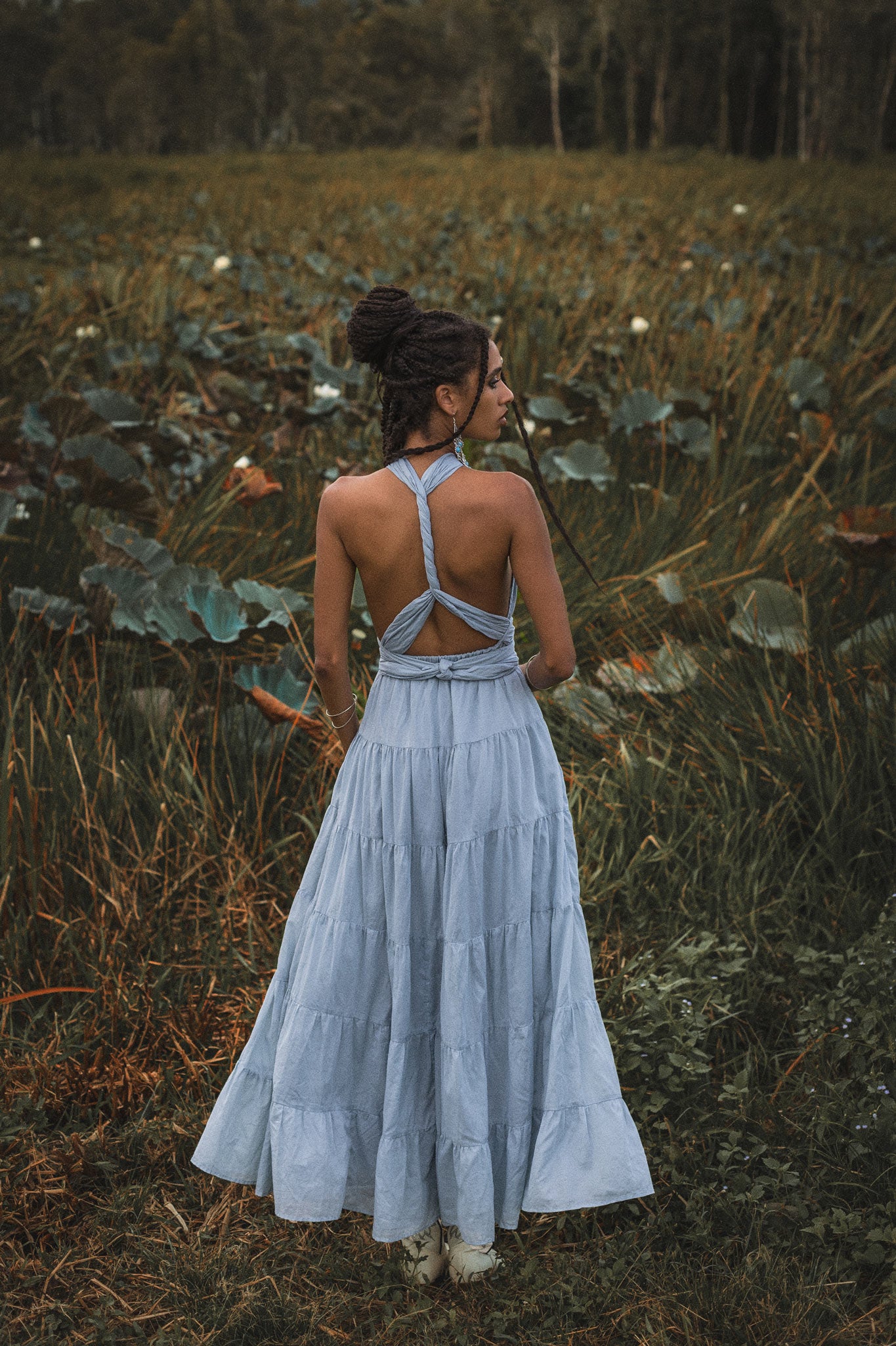 This light blue bohemian dress is perfect for any formal or informal event. The open back and adjustable straps make it both comfortable and stylish.
