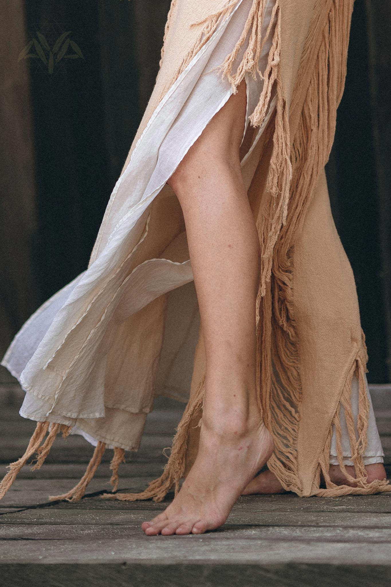 Timeless beige ochre dress with hand-looms and tassel border.