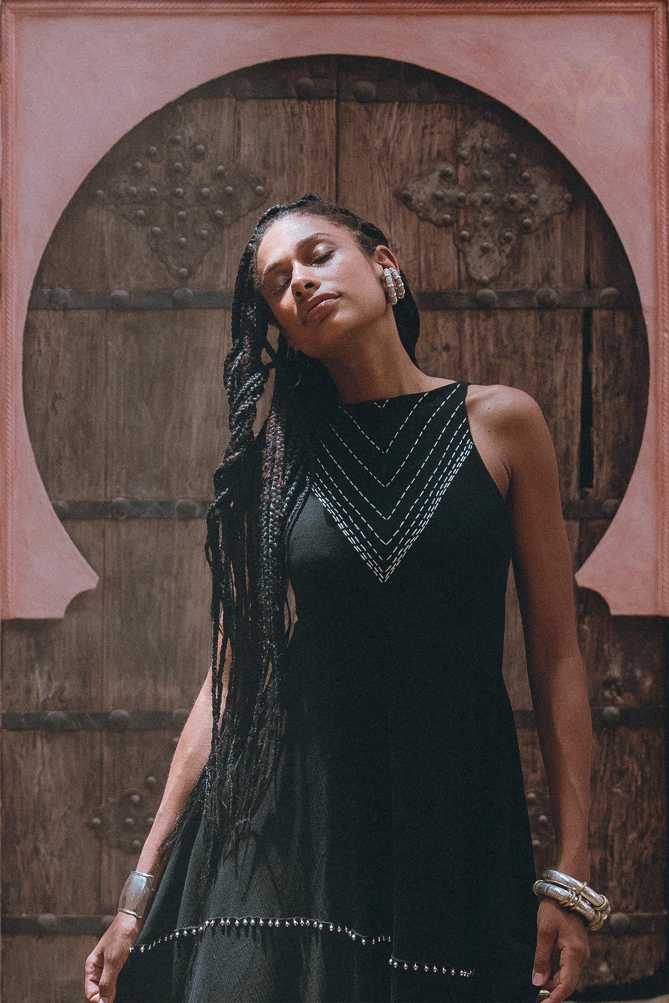 Refined style meets contemporary fashion in this black minimalist cocktail dress from Aya Sacred Wear.