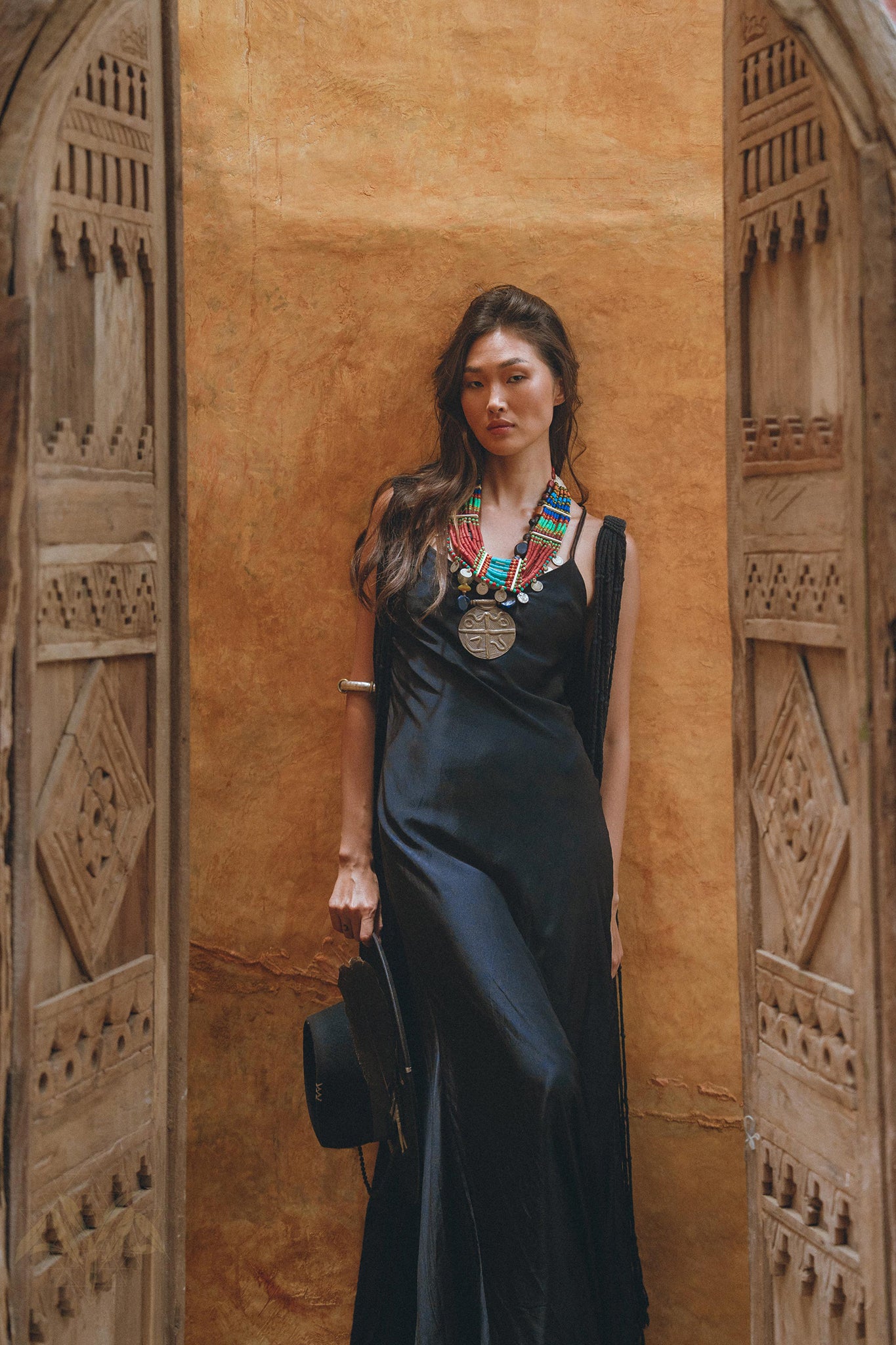 Embrace your inner goddess with the luxurious black cape dress from Aya Sacred Wear.
