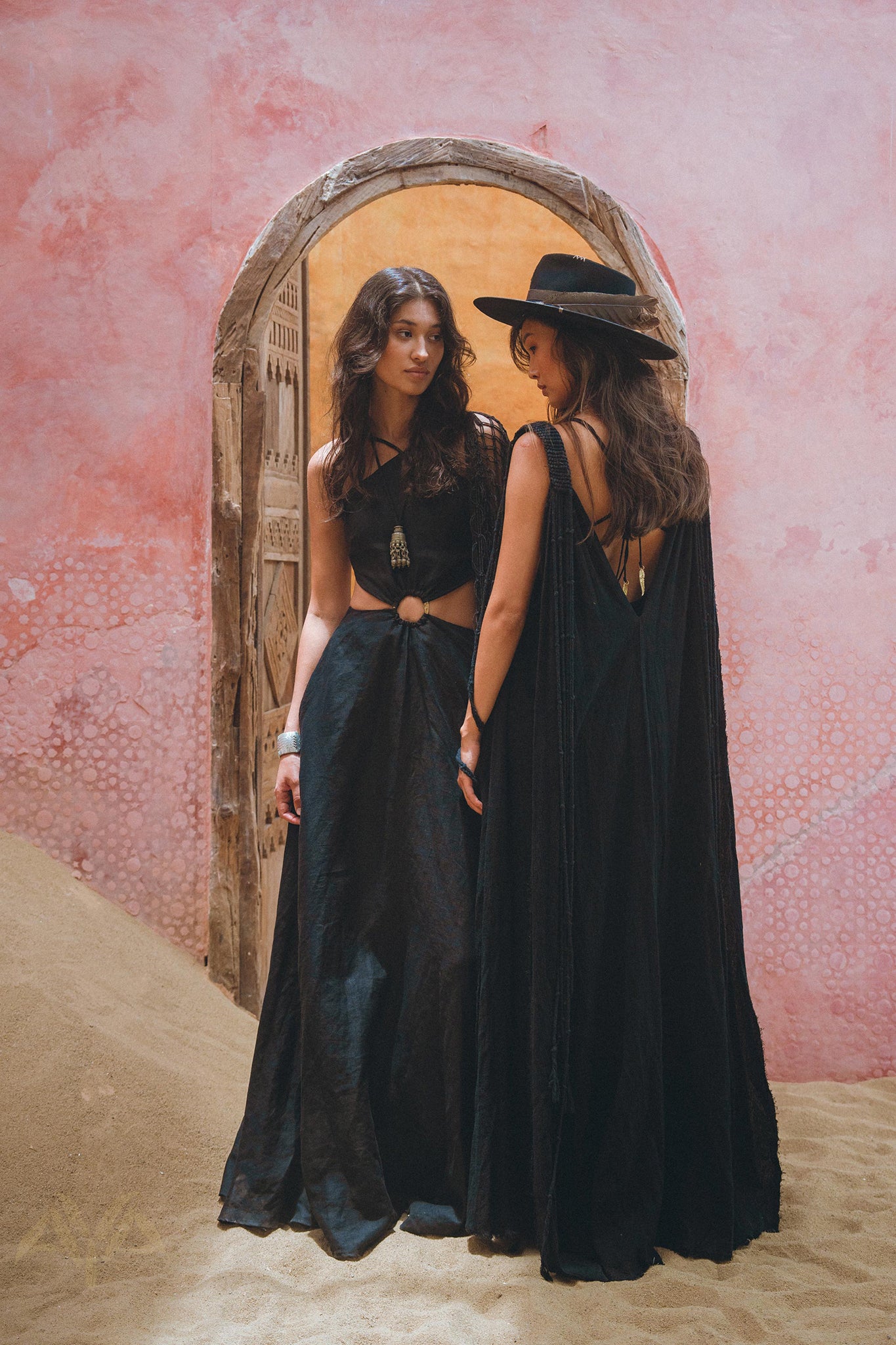 Show off your unique style with the one-of-a-kind black cape dress from Aya Sacred Wear.