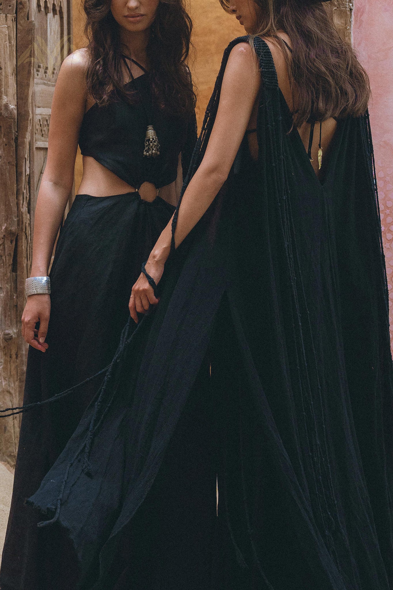 Feel divine in this stunning black cape dress by Aya Sacred Wear.