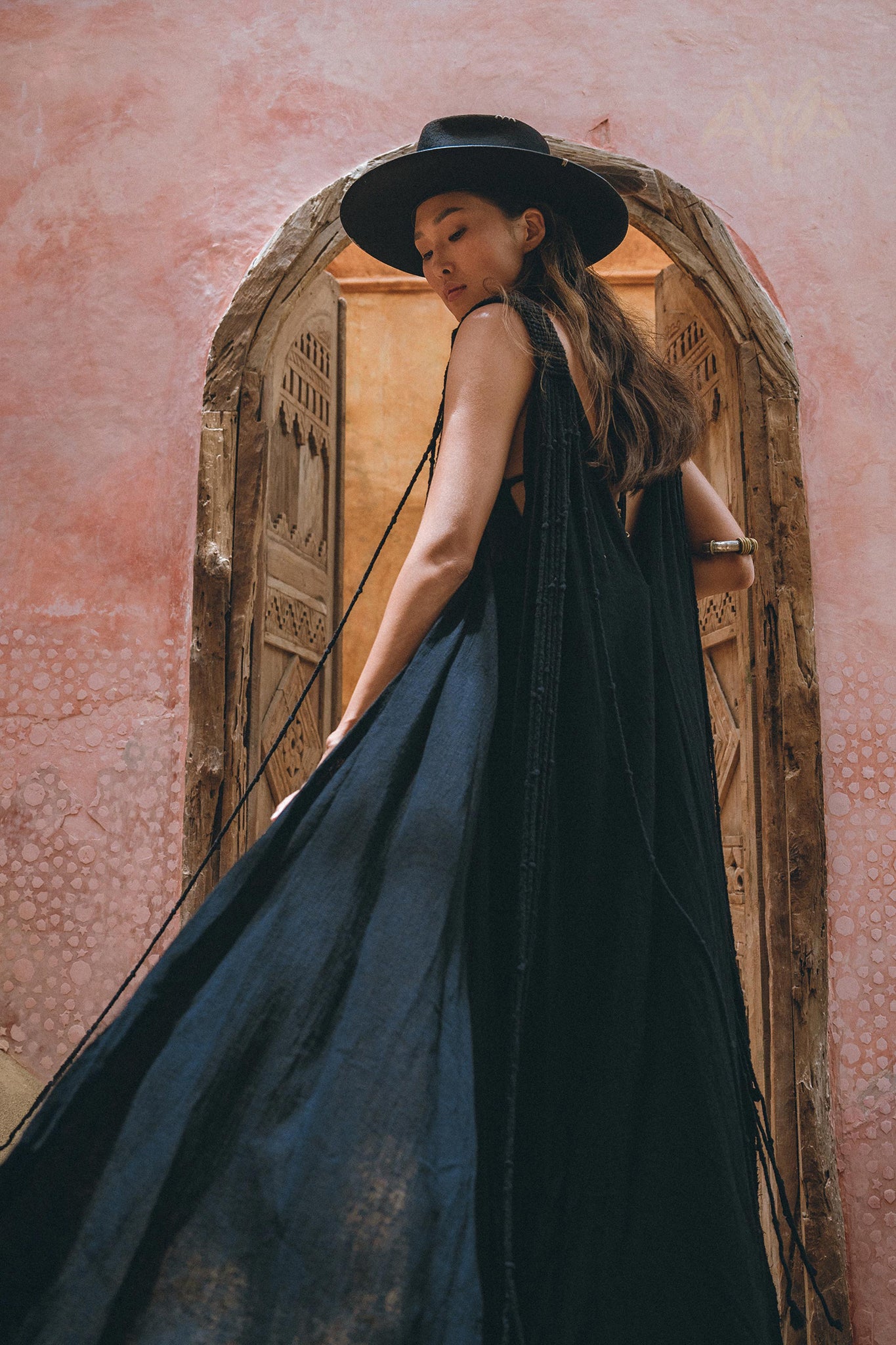 Be the center of attention in the beautiful black cape dress from Aya Sacred Wear.