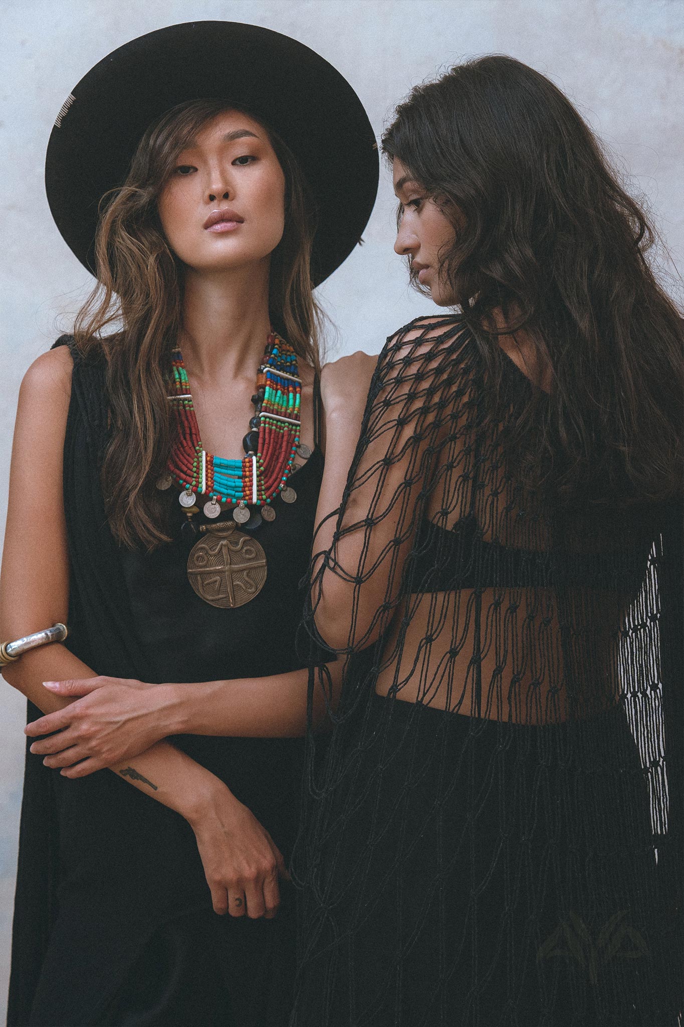 Get summer-ready with the black Summer Net Cover Up by Aya Sacred Wear.