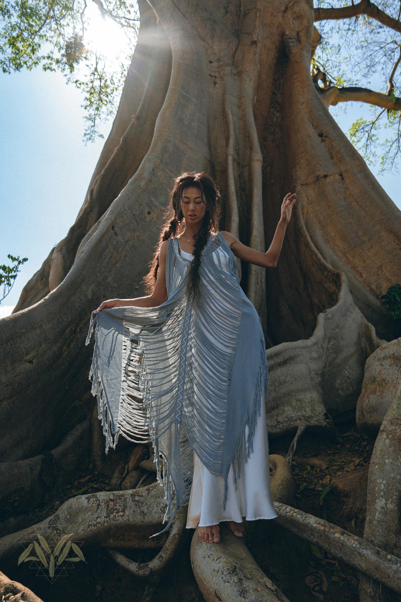 Crafted with care and skill, this bohemian dress is perfect for your summer wardrobe and features a hand-loomed layover and hand-embroidery.