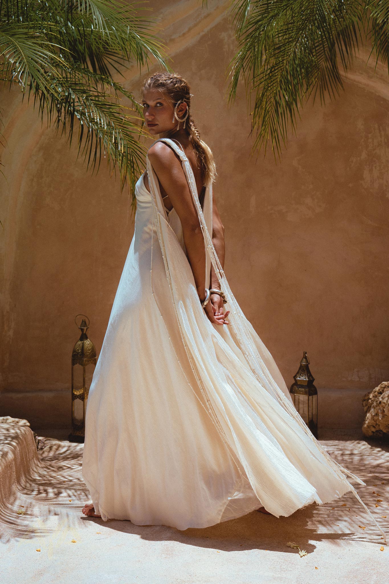 Make a bold statement in the Off-White Greek Goddess Cape Dress from Aya Sacred Wear.