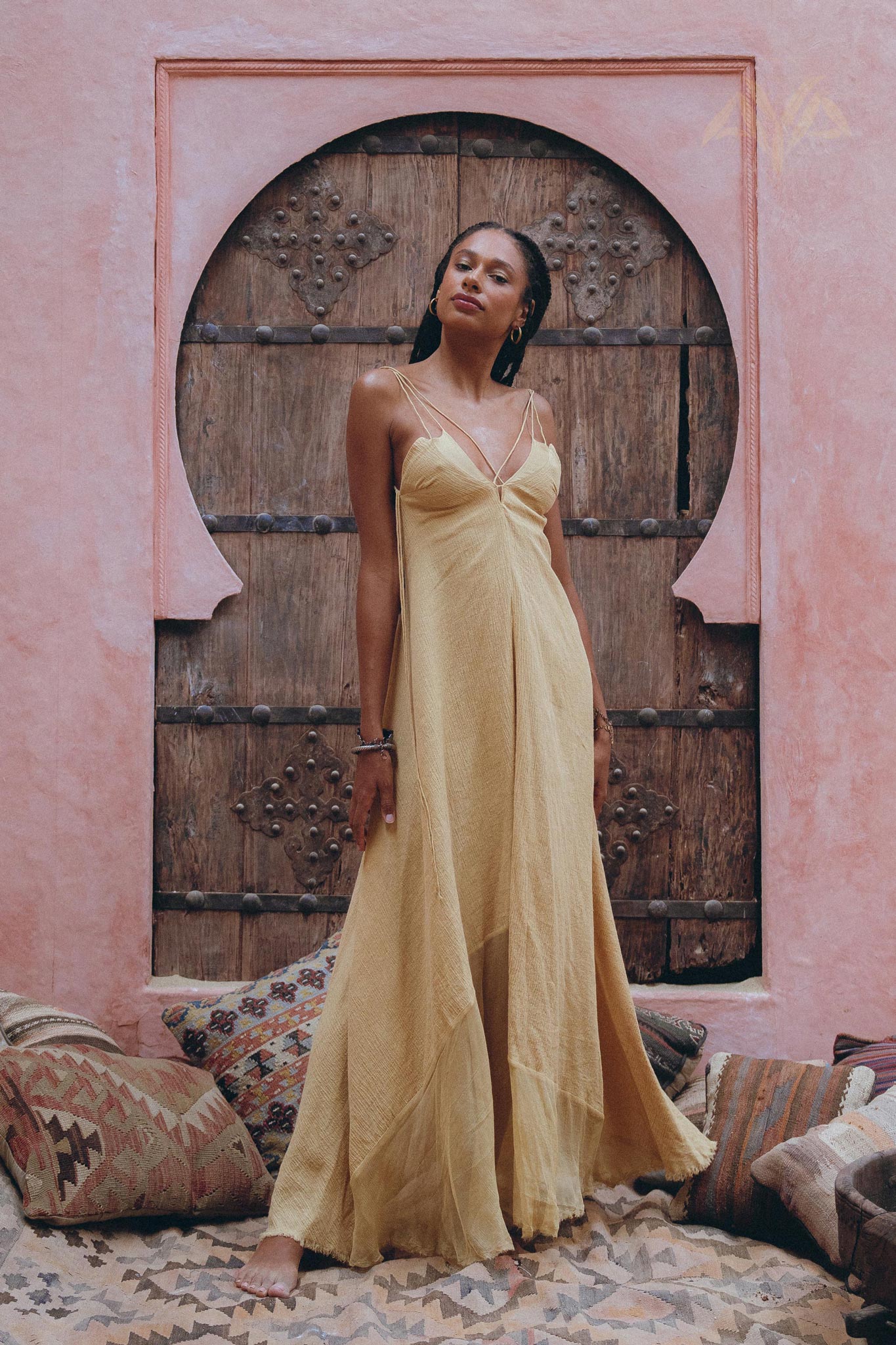 Make a statement with the elegant powder yellow dress from Aya Sacred Wear.